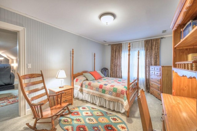 bedroom featuring light colored carpet and ornamental molding