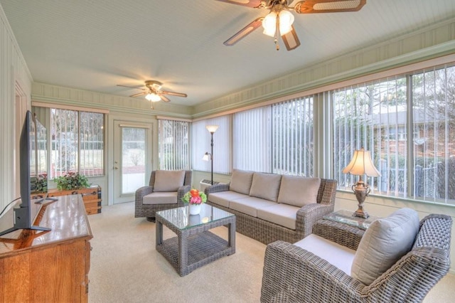 sunroom featuring ceiling fan