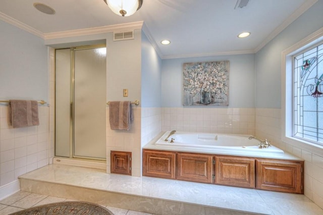 bathroom with ornamental molding, separate shower and tub, and tile patterned floors