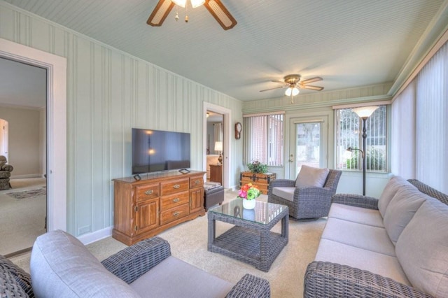 carpeted living room featuring ceiling fan