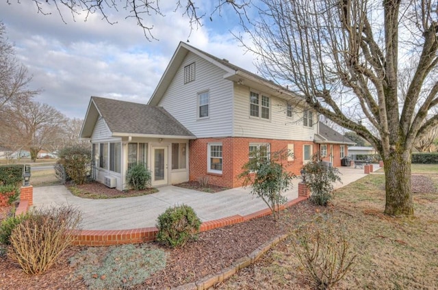 view of front of home featuring a sunroom