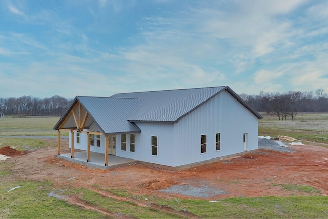 rear view of property featuring a patio