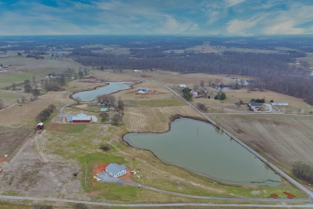 birds eye view of property with a water view and a rural view