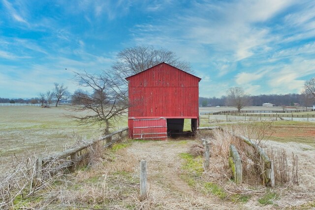 view of outbuilding featuring a rural view