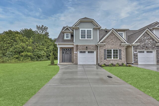 craftsman-style house with a garage and a front yard