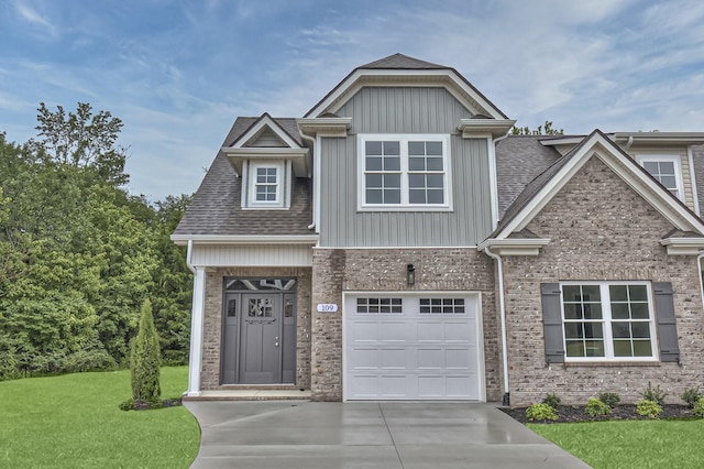 craftsman-style house with a garage and a front yard