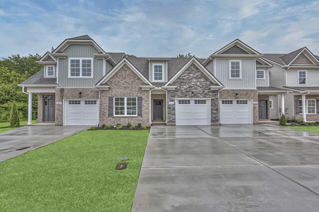 craftsman-style house with a garage and a front yard