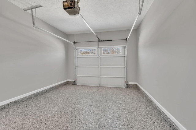 garage featuring baseboards and a garage door opener