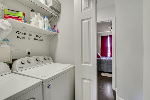 clothes washing area featuring hardwood / wood-style flooring and washing machine and clothes dryer