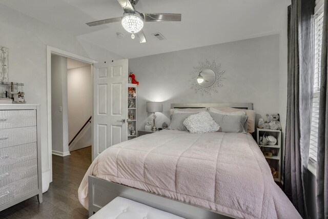 bedroom featuring dark hardwood / wood-style flooring and ceiling fan