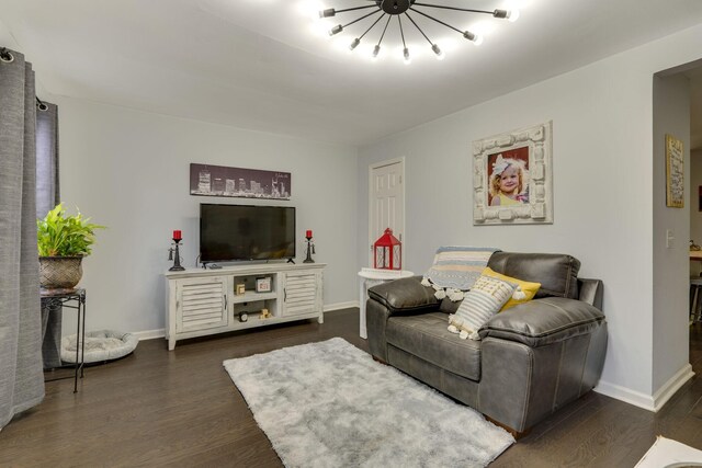 living room with dark wood-type flooring