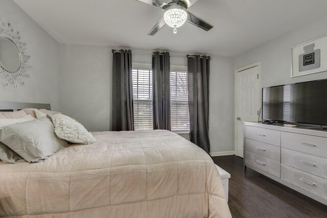 bedroom with ceiling fan and dark hardwood / wood-style flooring