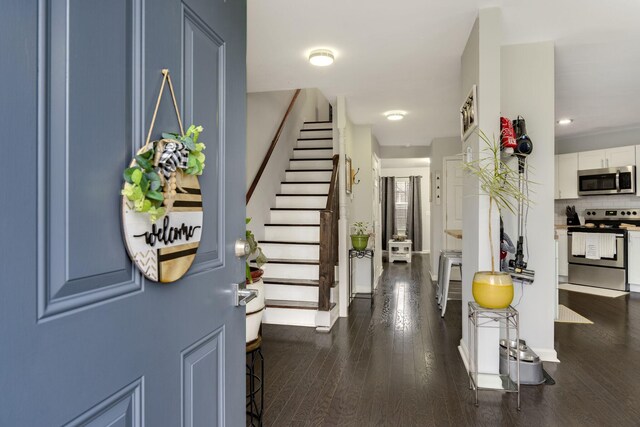 foyer with dark hardwood / wood-style flooring