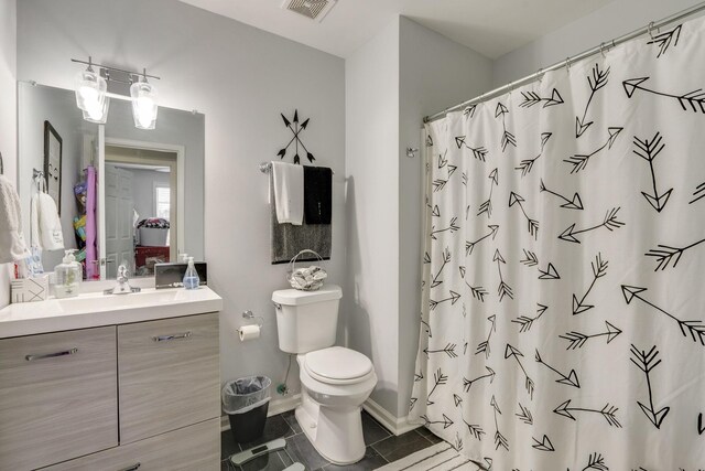 bathroom featuring vanity, tile patterned flooring, a shower with curtain, and toilet