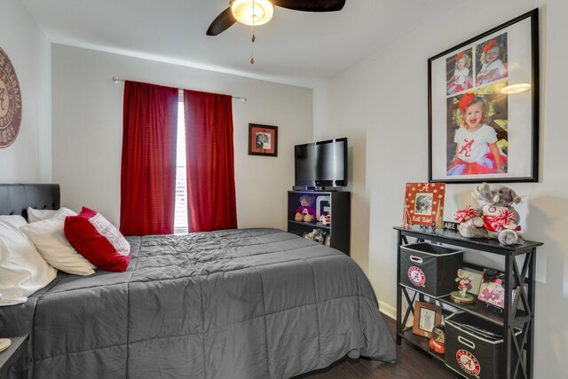 bedroom featuring ceiling fan and dark hardwood / wood-style flooring