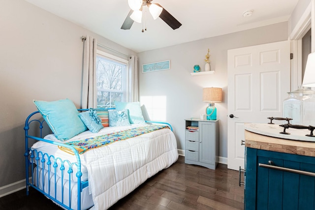 bedroom featuring ceiling fan and dark hardwood / wood-style flooring