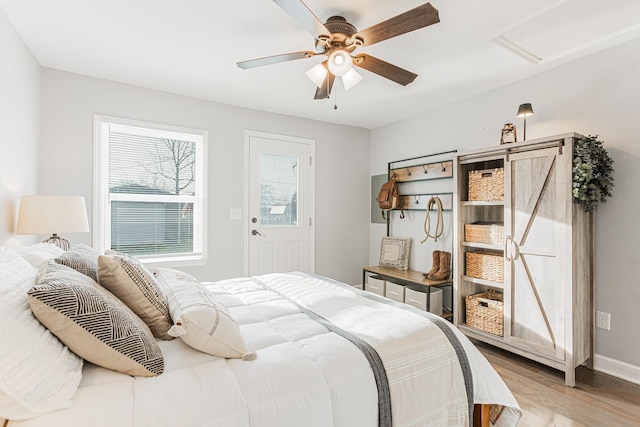 bedroom with ceiling fan and light wood-type flooring