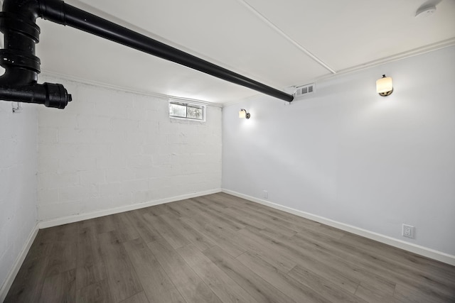 basement featuring wood-type flooring