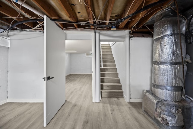 basement featuring light wood-type flooring