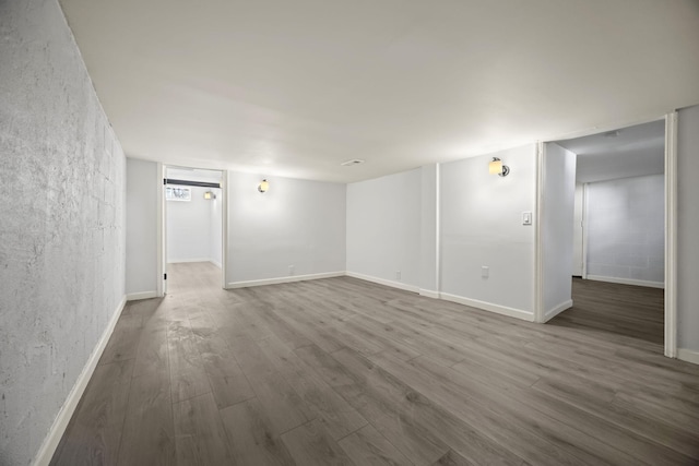 empty room with hardwood / wood-style flooring