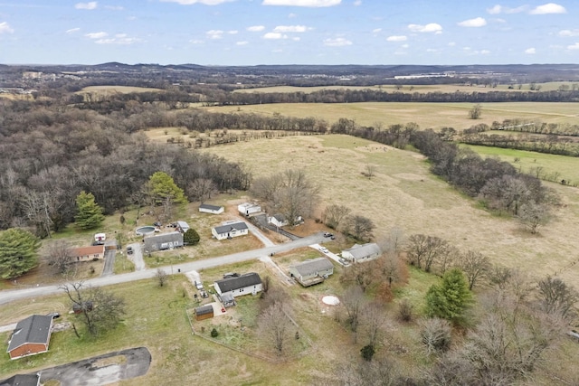 birds eye view of property featuring a rural view