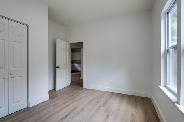 unfurnished bedroom with light hardwood / wood-style flooring