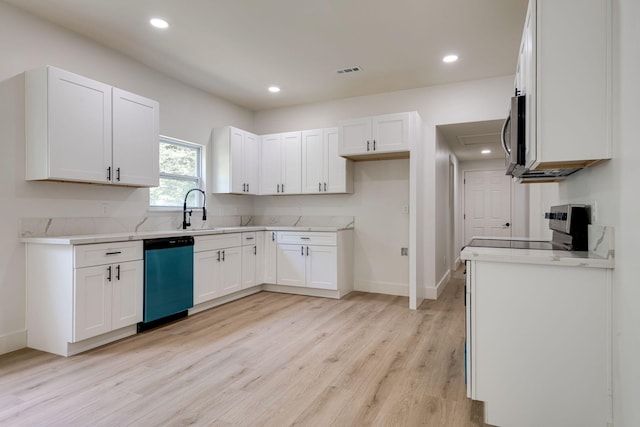 kitchen with white cabinetry, sink, stainless steel appliances, and light wood-type flooring