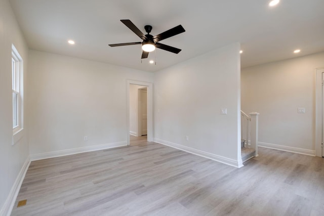 spare room featuring ceiling fan and light wood-type flooring