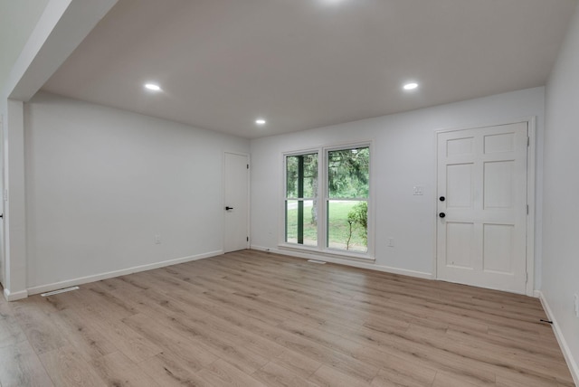 unfurnished room with light hardwood / wood-style flooring