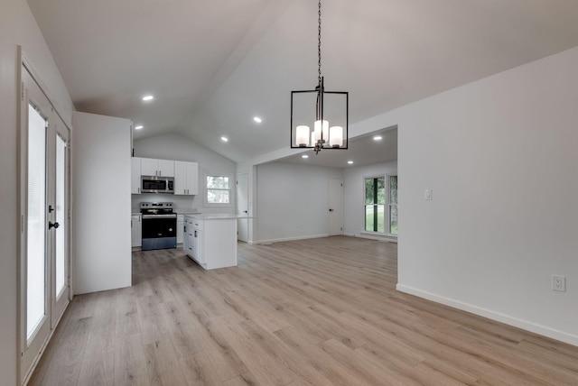 kitchen featuring white cabinetry, hanging light fixtures, light hardwood / wood-style floors, stainless steel appliances, and a healthy amount of sunlight