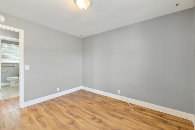 unfurnished room with light hardwood / wood-style floors