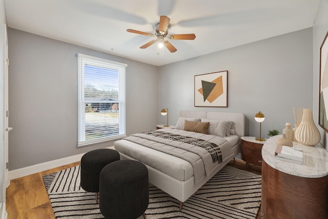 bedroom featuring wood-type flooring and ceiling fan