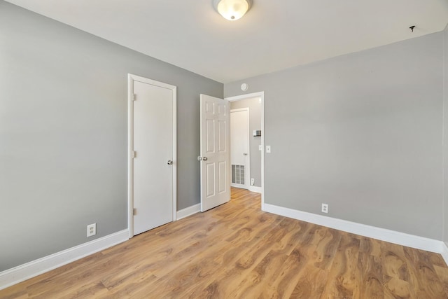 unfurnished bedroom with light hardwood / wood-style floors