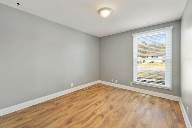 spare room with light hardwood / wood-style floors