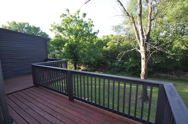 deck featuring a lawn