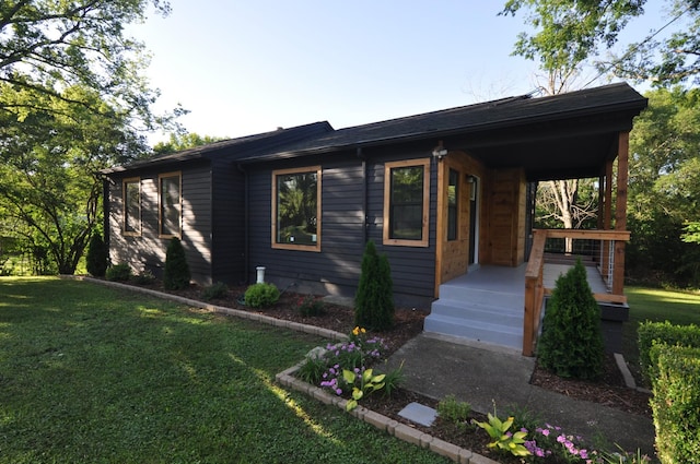 ranch-style home with a front yard and a porch