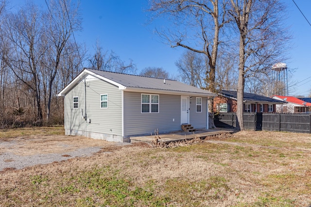 back of house with a yard