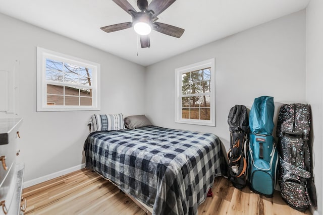 bedroom featuring light hardwood / wood-style floors and ceiling fan