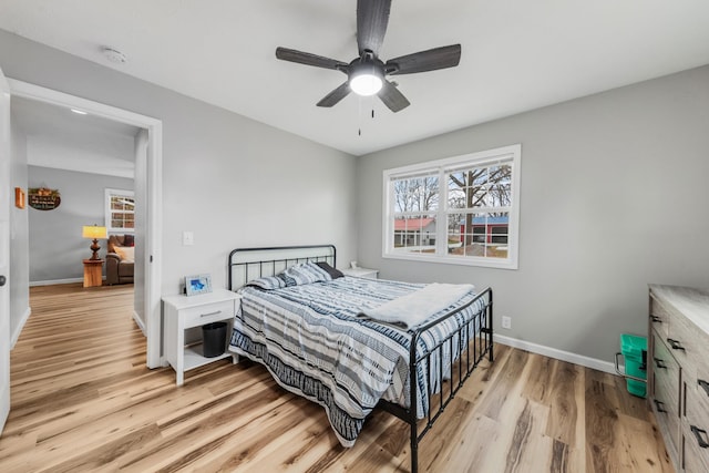 bedroom featuring ceiling fan and light wood-type flooring