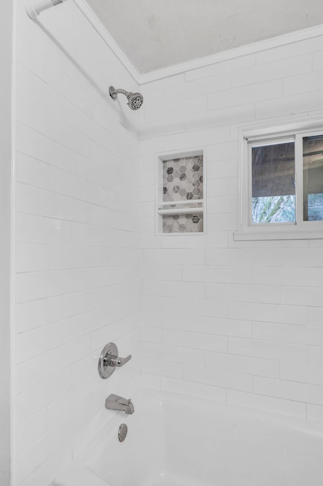 room details featuring tiled shower / bath