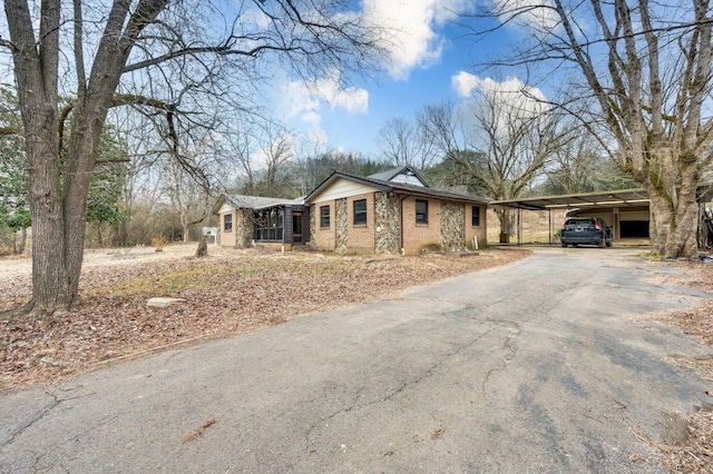 single story home featuring a carport