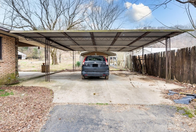 view of parking / parking lot featuring a carport