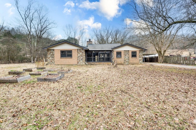 view of front of property featuring a sunroom