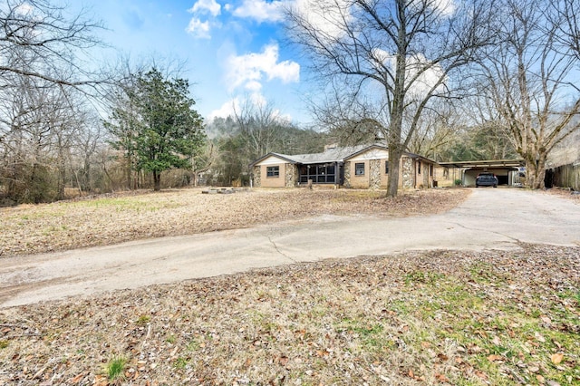 ranch-style house featuring a carport