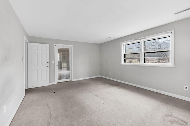 unfurnished room with light colored carpet