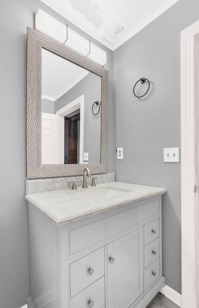 bathroom featuring vanity and ornamental molding