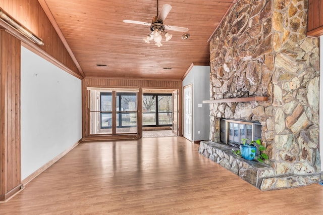 unfurnished living room featuring a fireplace, wood ceiling, light hardwood / wood-style flooring, and ceiling fan