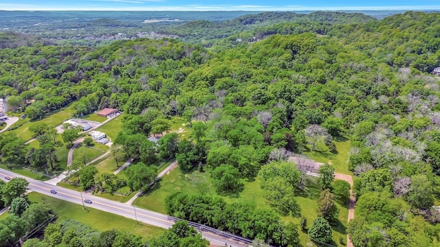 aerial view featuring a wooded view