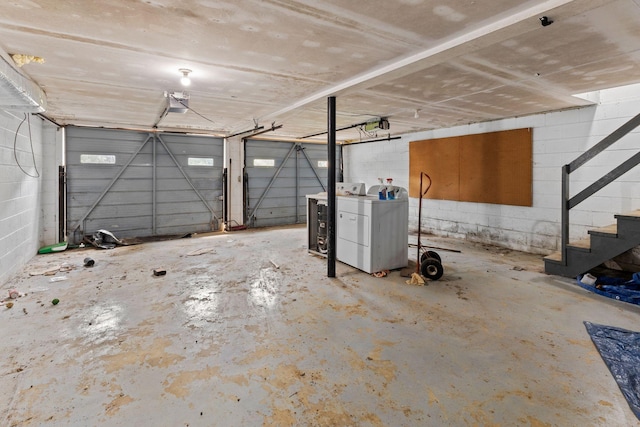 garage with concrete block wall and a garage door opener