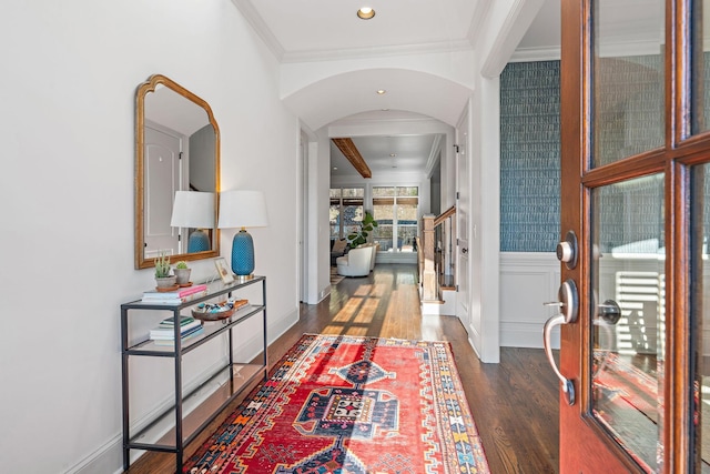 corridor with dark wood-type flooring and ornamental molding